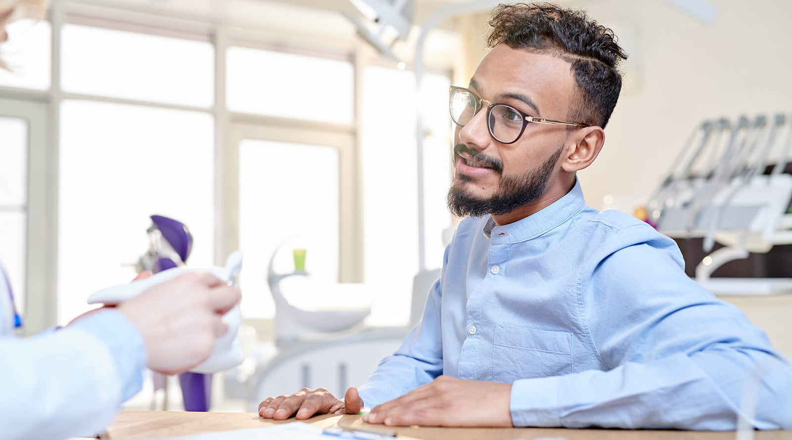 Man at the doctor's office learning about the side effects of a prostatectomy