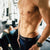 Shirtless midsection of very fit man at gym