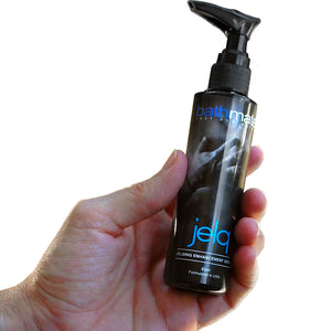 max out jelqing enhancement serum bottle held in hand